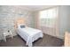 Inviting bedroom with a stylish accent wall and bright natural light at 241 Lost Lake Way, Villa Rica, GA 30180