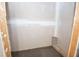 Unfinished closet with bare walls and carpet flooring at 241 Lost Lake Way, Villa Rica, GA 30180