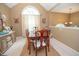 Spacious dining room featuring a wood table, neutral walls, and ample natural light at 241 Lost Lake Way, Villa Rica, GA 30180