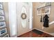 Cozy home entryway featuring a decorative ladder, coat rack, and lovely wood flooring at 241 Lost Lake Way, Villa Rica, GA 30180