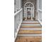 View of the home's front door with a decorative wreath, flanked by planters and stone veneer at 241 Lost Lake Way, Villa Rica, GA 30180