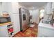 Efficient kitchen layout with stainless steel appliances, white cabinets, and access to the dining area at 241 Lost Lake Way, Villa Rica, GA 30180