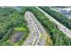 Aerial image of a townhome community featuring a pond and easy access to highway in a vibrant location at 315 Duval Dr, Alpharetta, GA 30009