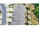 Birds-eye view of new townhomes showing their roofs and backyards with a privacy barrier and some greenery at 315 Duval Dr, Alpharetta, GA 30009