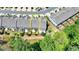 A townhome is nestled within a community, featuring a patio and landscaping offering privacy and charm at 315 Duval Dr, Alpharetta, GA 30009