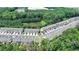 Aerial view of a community townhome located near a pond and surrounded by nature with easy access to community amenities at 315 Duval Dr, Alpharetta, GA 30009