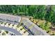 An aerial view showcases the rear of a townhome with a view of the lush green space and landscaping at 315 Duval Dr, Alpharetta, GA 30009