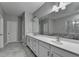 Spacious bathroom featuring double vanity, tile flooring, and shower and tub at 315 Duval Dr, Alpharetta, GA 30009