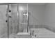 Modern bathroom showcasing tiled shower, soaking tub, and chrome fixtures at 315 Duval Dr, Alpharetta, GA 30009
