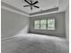 Neutral bedroom featuring tray ceilings, carpeted floors, and bright windows at 315 Duval Dr, Alpharetta, GA 30009