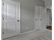 Neutral bedroom showcasing an ensuite bathroom and large closet space at 315 Duval Dr, Alpharetta, GA 30009