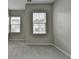 Bright bedroom featuring plush carpet and large windows with neighborhood views at 315 Duval Dr, Alpharetta, GA 30009