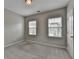 Comfortable bedroom featuring natural light, a light fixture, plush carpet, and bright, neutral paint at 315 Duval Dr, Alpharetta, GA 30009