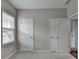 Bedroom with plush carpet, bright neutral paint, and closet access at 315 Duval Dr, Alpharetta, GA 30009