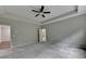 Neutral bedroom featuring tray ceilings, carpeted floors, and ensuite bathroom at 315 Duval Dr, Alpharetta, GA 30009
