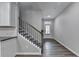 Inviting entryway with wood-look floors, staircase, and a front door allowing natural light to fill the space at 315 Duval Dr, Alpharetta, GA 30009