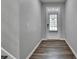 Inviting entryway with wood-look flooring, freshly painted walls, and a glass-paneled front door at 315 Duval Dr, Alpharetta, GA 30009