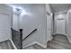 Bright hallway with wood-look floors and a modern light fixture leading to several rooms at 315 Duval Dr, Alpharetta, GA 30009