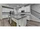 Bright and airy kitchen features granite counters, stainless appliances, and white cabinets at 315 Duval Dr, Alpharetta, GA 30009