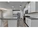 Bright kitchen with stainless steel appliances, ample white cabinetry, and a center island at 315 Duval Dr, Alpharetta, GA 30009