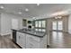 Bright, open kitchen featuring a large island with granite countertops and stainless steel appliances at 315 Duval Dr, Alpharetta, GA 30009