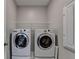 Laundry room featuring modern side-by-side washing machine and dryer at 315 Duval Dr, Alpharetta, GA 30009