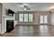 Spacious living room with abundant natural light, chandelier, hardwood floors and access to the patio at 315 Duval Dr, Alpharetta, GA 30009
