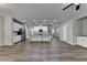 Spacious living room featuring vinyl floors, stainless steel appliances, and stairs to upper level at 315 Duval Dr, Alpharetta, GA 30009