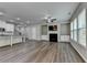 Bright living room with a fireplace, built-in cabinets, and large windows at 315 Duval Dr, Alpharetta, GA 30009