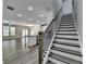 Open-concept living space with hardwood floors, modern staircase, and ample natural light at 315 Duval Dr, Alpharetta, GA 30009