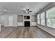 Spacious living room featuring a fireplace, built-in cabinets, and lots of natural light at 315 Duval Dr, Alpharetta, GA 30009