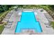 Overhead view of a refreshing community pool with lounge chairs, umbrellas and clean landscaping at 315 Duval Dr, Alpharetta, GA 30009