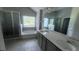 Bathroom featuring dual sinks, a soaking tub, a separate shower, and modern fixtures at 3750 Richmond Bnd, Lithonia, GA 30038