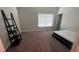 Bedroom featuring a platform bed, large window, and neutral carpet at 3750 Richmond Bnd, Lithonia, GA 30038