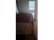 Bedroom featuring a comfortable bed, neutral carpet, and bright natural light from a window at 3750 Richmond Bnd, Lithonia, GA 30038