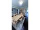 Elegant dining room with a large table, decorative china cabinet, and stylish lighting at 3750 Richmond Bnd, Lithonia, GA 30038