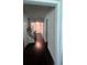 Inviting foyer with hardwood floors, staircase, and a view of the front door at 3750 Richmond Bnd, Lithonia, GA 30038