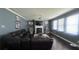 Inviting living room featuring a fireplace, large windows, and a comfortable seating area at 3750 Richmond Bnd, Lithonia, GA 30038