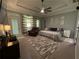 Spacious main bedroom with trey ceiling, neutral walls, an exterior door, and updated ceiling fan at 134 Carolinas Way, Fayetteville, GA 30215