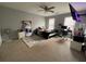 Spacious bedroom with a ceiling fan, natural light, and ample space for relaxation and personalization at 134 Carolinas Way, Fayetteville, GA 30215
