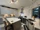 Modern kitchen featuring quartz countertops, subway tile backsplash, and stainless steel appliances at 134 Carolinas Way, Fayetteville, GA 30215