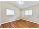This bedroom features hardwood floors and two windows for plenty of light at 2600 Nw Baker Rd, Atlanta, GA 30318