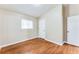 This bedroom includes hardwood floors, neutral walls, and a window for natural light at 2600 Nw Baker Rd, Atlanta, GA 30318