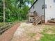Expansive backyard featuring a wooden deck, stairs, and a charming wooden fence at 3640 Pollys Blf, Cumming, GA 30028