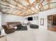 Finished basement with a seating area, carpet, and drywalled walls with exposed ceiling at 3640 Pollys Blf, Cumming, GA 30028