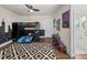 This bedroom features a loft bed, a chalkboard wall, and an attached bathroom, creating a fun and functional space at 3640 Pollys Blf, Cumming, GA 30028
