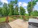 Wooden deck overlooking backyard is a perfect spot for outdoor relaxation and grilling at 3640 Pollys Blf, Cumming, GA 30028
