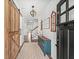 Charming entryway featuring a sliding barn door, shiplap walls, and stylish decor creating a warm and inviting space at 3640 Pollys Blf, Cumming, GA 30028