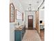 Inviting entryway featuring a sliding barn door, wood floors, and stylish decor at 3640 Pollys Blf, Cumming, GA 30028