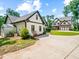 Beautiful, landscaped homes with a long driveway and well-manicured lawn at 3640 Pollys Blf, Cumming, GA 30028